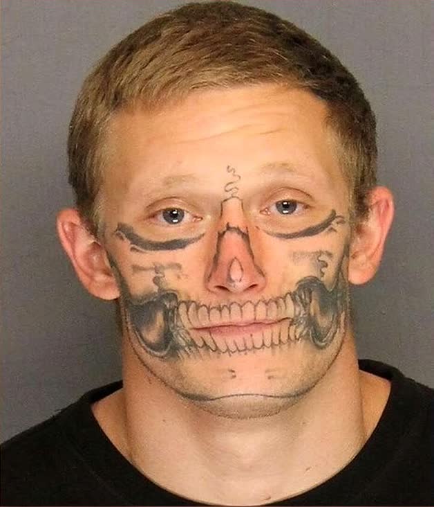 California inmate Corey Hughes fled prison work crew with skull face tattoo — then sued arresting officers over dog bite
